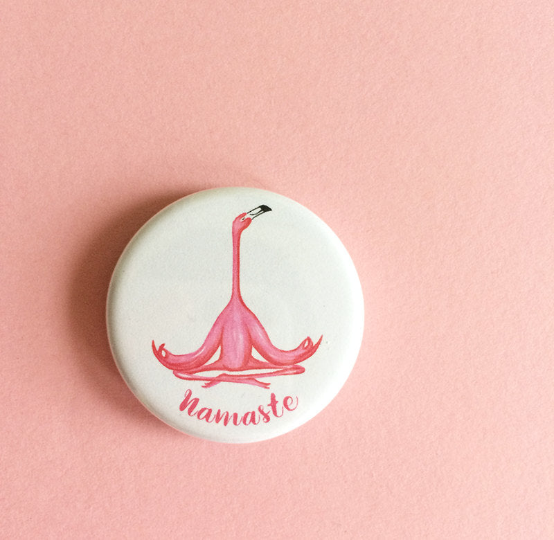 Namaste magnet or pin with meditating pink flamingo