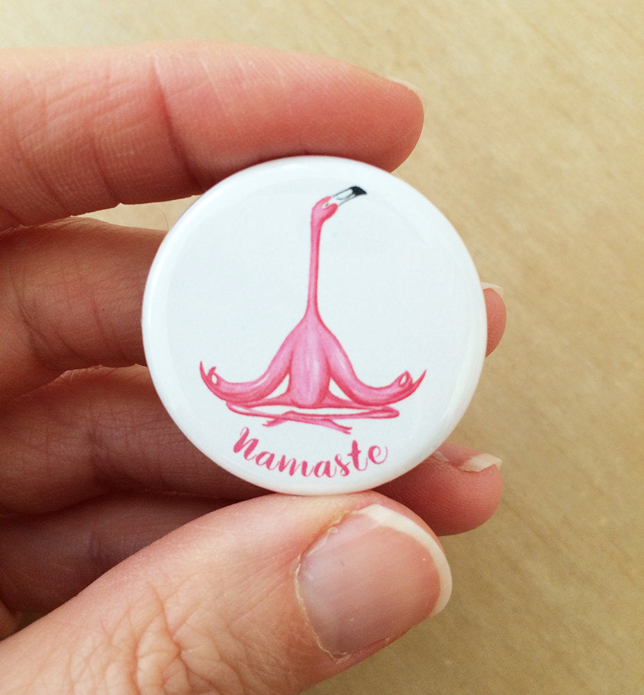 Namaste magnet or pin with meditating pink flamingo