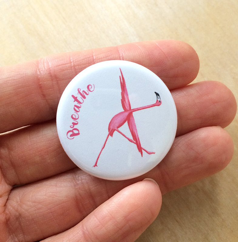 Magnet or pin of pink flamingo doing yoga